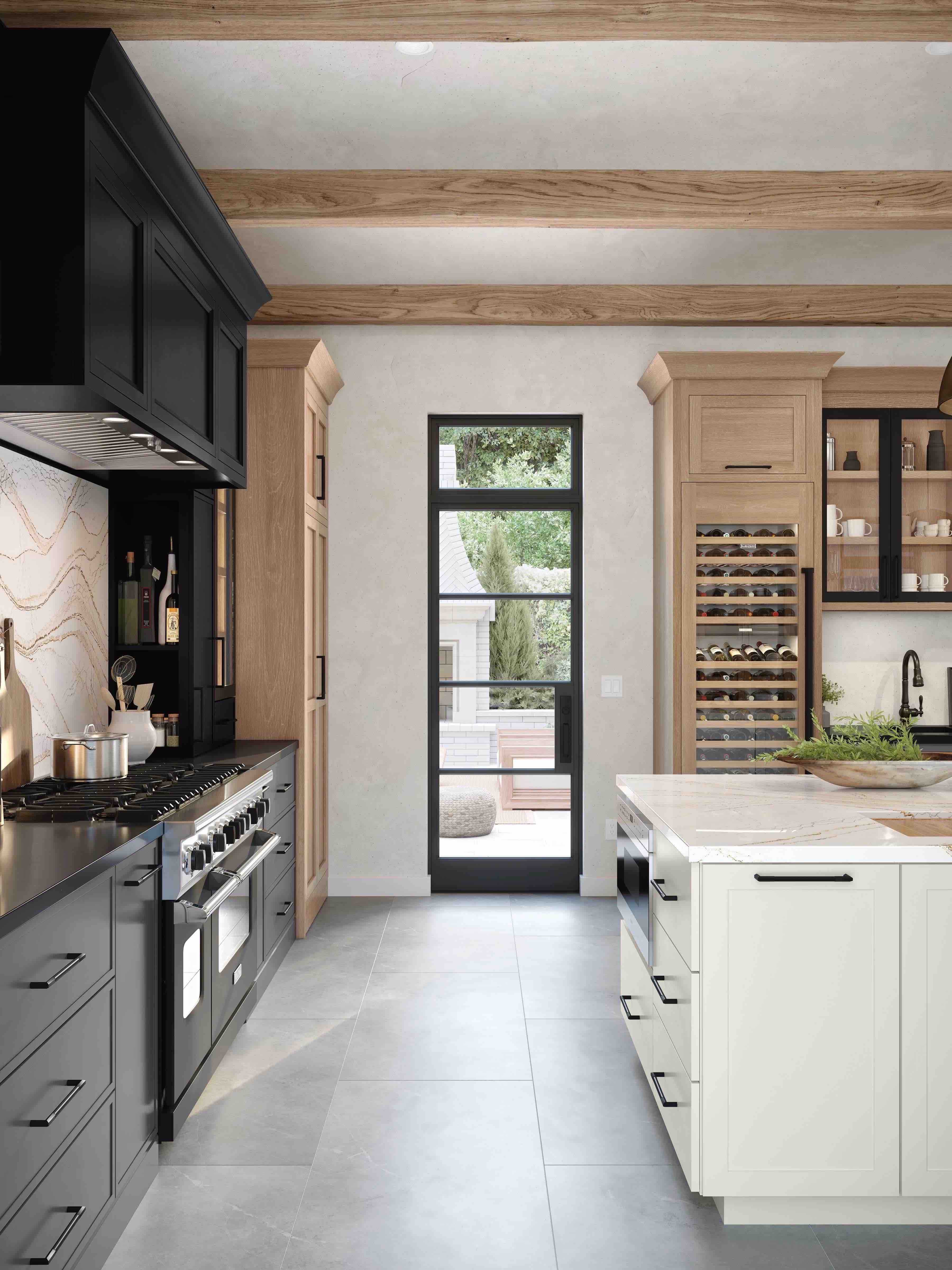 modern kitchen with black and white painted cabinets and tile floors