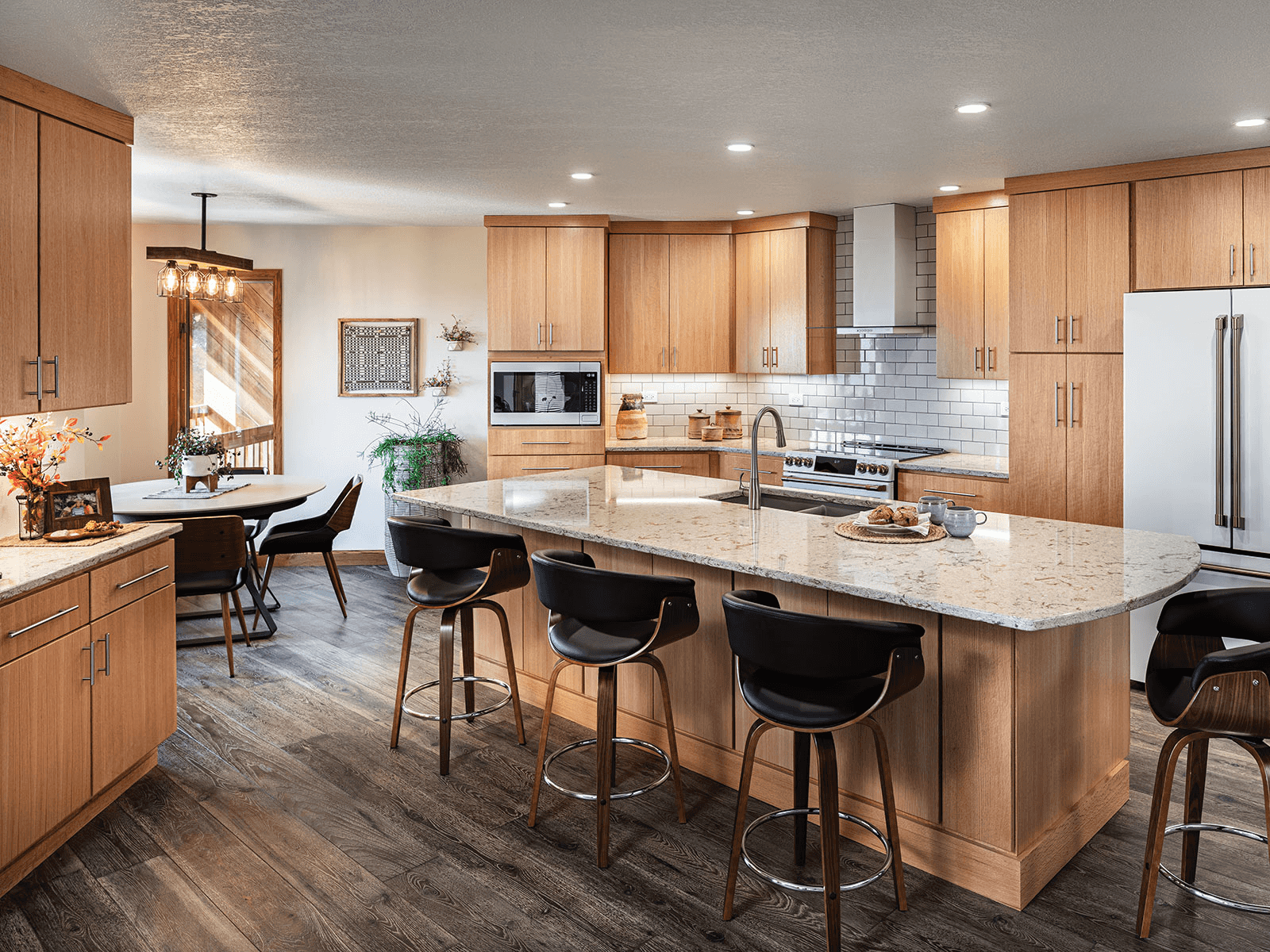 kitchen with natural wood cabinets with gray wood floors