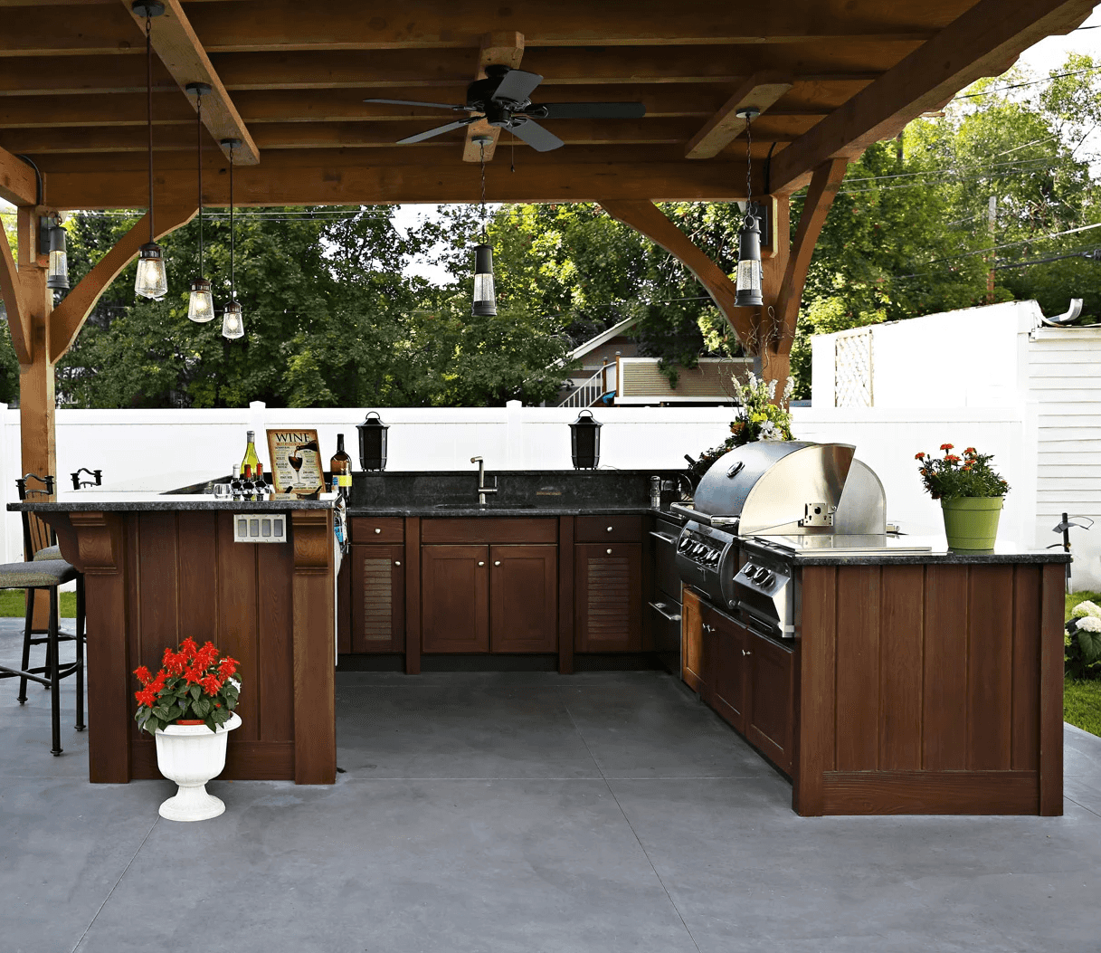 outdoor kitchen with dark brown cabinets